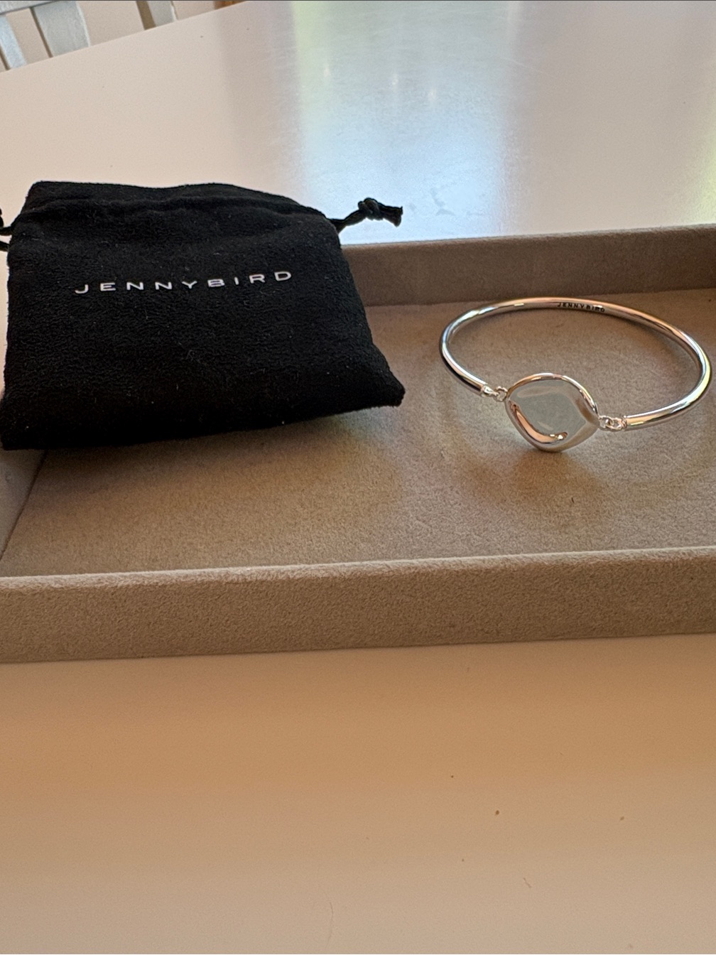 Jenny Bird Silver Bangle With Silver Flat Petal Center
